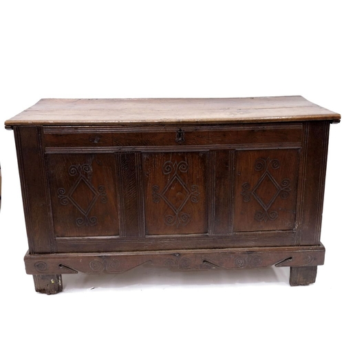 354 - A late 17th Century oak chest, chip carved and moulded top, triple panel front with lozenge carved d... 