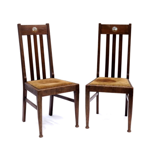 377 - A pair of Mission style Arts and Crafts chairs, the slatted backs inlaid with stylised mother of pea... 