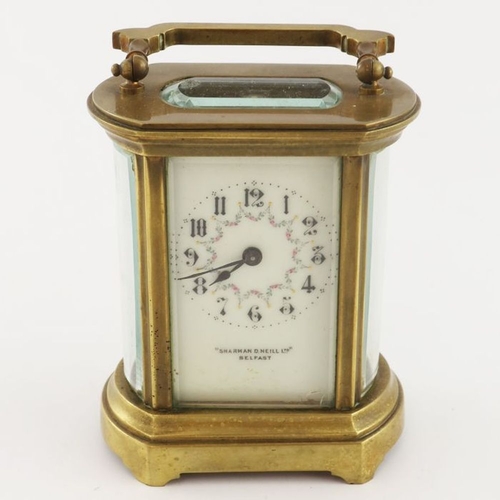 385 - A 19th century gilt brass carriage timepiece, rounded glass sides and white enamelled dial with garl... 