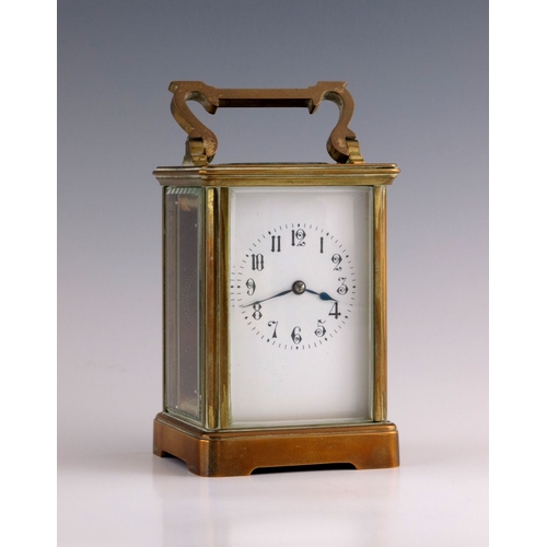 386 - A French carriage timepiece, early 20th Century, brass corniche case, oval escapement window, white ... 