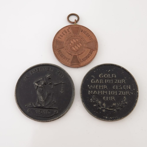 396 - World War One medals; two German 'Gold for Iron' campaign medals, together with a Landwehr service a... 