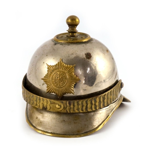 399 - World War One German trench art, an inkwell in the form of a pickelhaube helmet, hinged top with bra... 