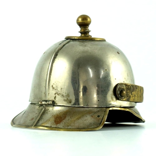 399 - World War One German trench art, an inkwell in the form of a pickelhaube helmet, hinged top with bra... 