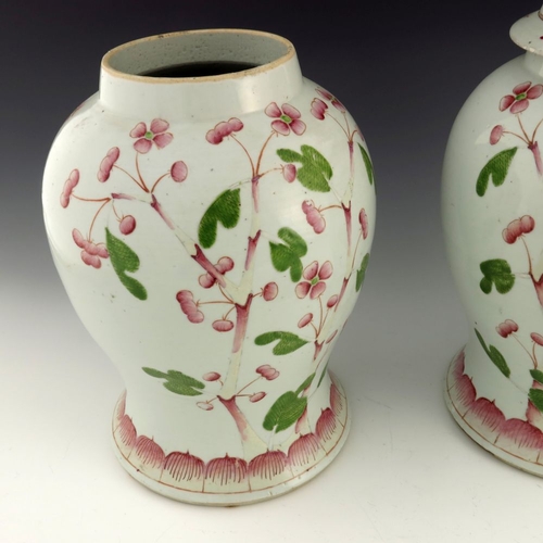 428 - A pair of Chinese famille rose temple jars and covers, Qing, 19th century, inverse baluster form wit... 