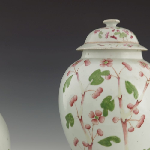 428 - A pair of Chinese famille rose temple jars and covers, Qing, 19th century, inverse baluster form wit... 