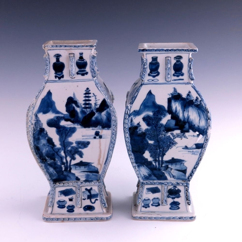 430 - A pair of Chinese blue and white baluster vases, Kangxi, 1662-1722, of rectangular section baluster ... 