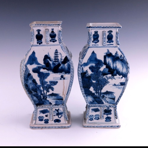 430 - A pair of Chinese blue and white baluster vases, Kangxi, 1662-1722, of rectangular section baluster ... 