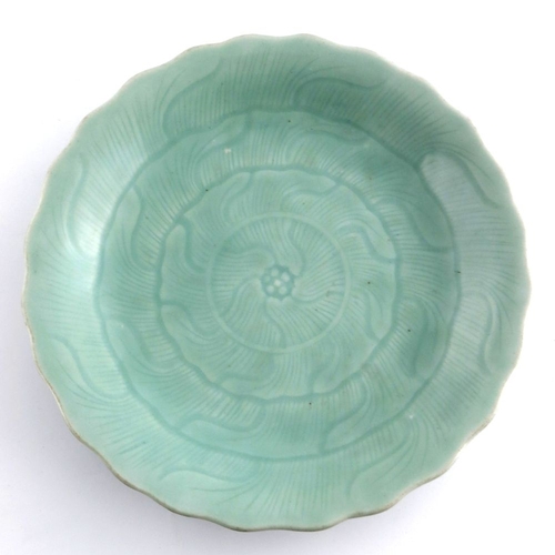 432 - A 19th Century Chinese celadon glaze plate, wavy rim, underglaze petal design, blue Qianlong seal ma... 