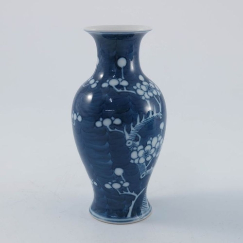 435 - A Chinese blue and white vase, shouldered inverse baluster form, painted with prunus on crackled ice... 