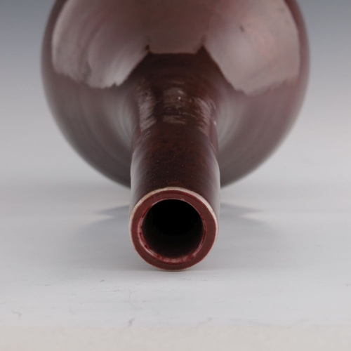 437 - A 19th Century Chinese sang de boeuf glaze bottle vase, extended neck, height 42cm