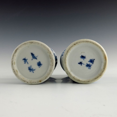 442 - A pair of 19th Chinese blue and white sleeve vases, decorated with dragons amongst foliage, blue pai... 