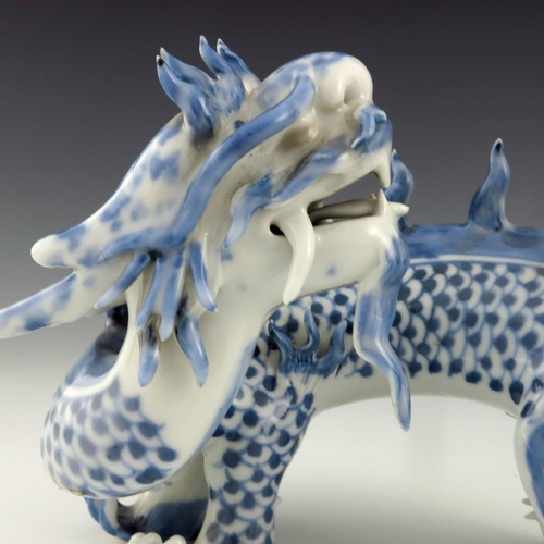 456 - A Japanese Hirado porcelain figure of a dragon, Meiji period, 1868-1912, blue scales, four claws, mo... 