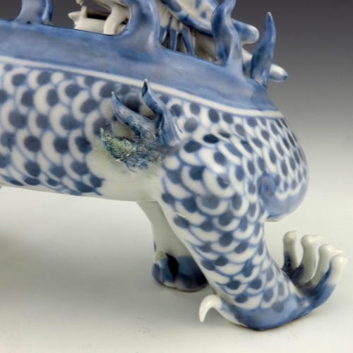 456 - A Japanese Hirado porcelain figure of a dragon, Meiji period, 1868-1912, blue scales, four claws, mo... 