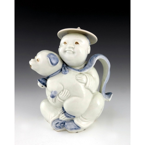 462 - A Japanese Hirado porcelain teapot, Meiji period, 1868-1912, modelled as a small boy wearing a rice ... 