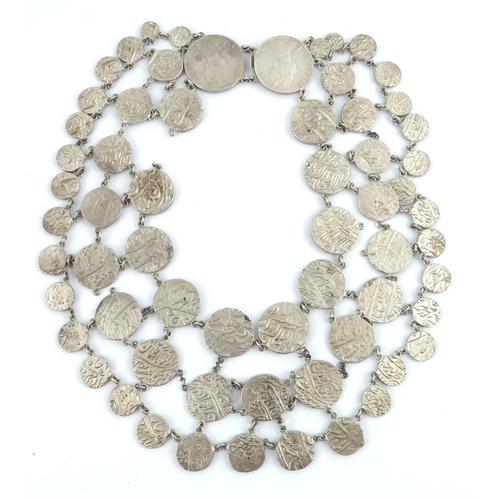 491 - An Anglo-Indian 19th century silver rupee festoon necklace, with double coin push-piece clasp, inclu... 