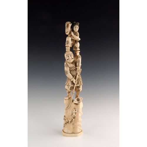 501 - λ A Japanese ivory tusk carving, Meiji period, 1868-1912, carved as a samurai on a rocky outcrop wit... 