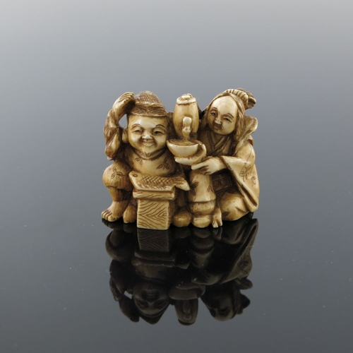 504 - λ A Japanese ivory netsuke, Meiji period, 1868-1912, carved as a fisherman and lady companion taking... 