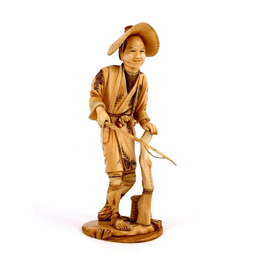 515 - λ A Japanese ivory okimono, Meiji period, 1868-1912, carved as a fisherman wearing a rice hat and wi... 