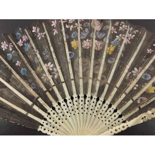 523 - λ A circa 1660-1670 European fan of ivory and vellum painted with various musicians in a landscape, ... 