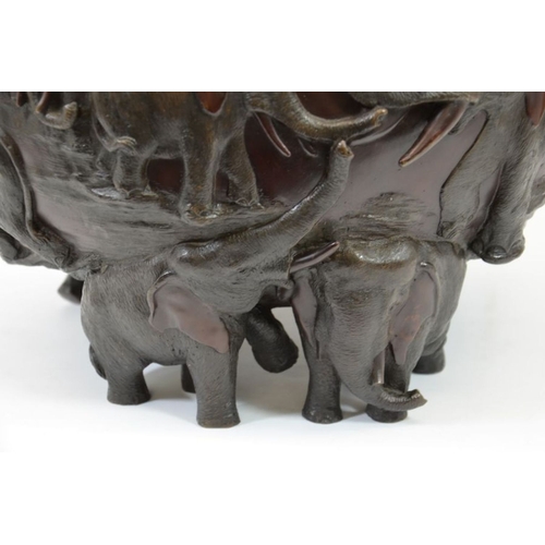 524 - Genryusai Seiya, a Japanese bronze jardiniere, Meiji, circa 1900, modelled in relief with elephants,... 