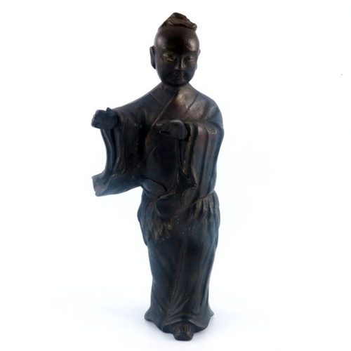 534 - An antique Chinese provincial bronze study of a lady, standing wearing a robe, traces of gilding, he... 