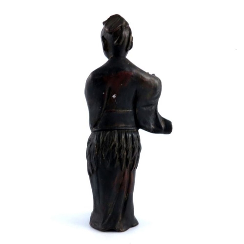 534 - An antique Chinese provincial bronze study of a lady, standing wearing a robe, traces of gilding, he... 