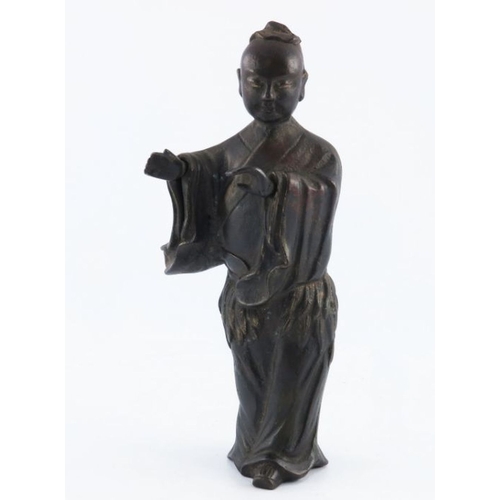 534 - An antique Chinese provincial bronze study of a lady, standing wearing a robe, traces of gilding, he... 