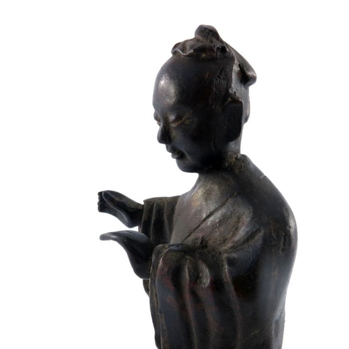 534 - An antique Chinese provincial bronze study of a lady, standing wearing a robe, traces of gilding, he... 