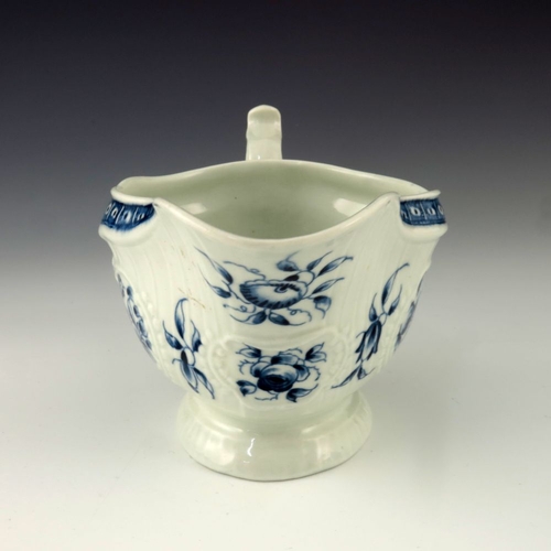 1171 - A Worcester blue and white relief moulded sauce boat, circa 1775, crescent mark, painted in the Stra... 