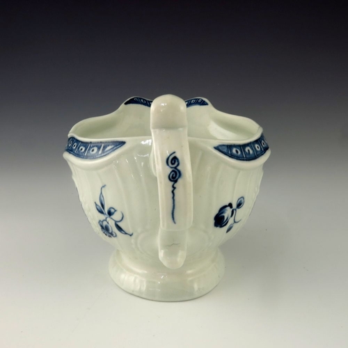 1171 - A Worcester blue and white relief moulded sauce boat, circa 1775, crescent mark, painted in the Stra... 