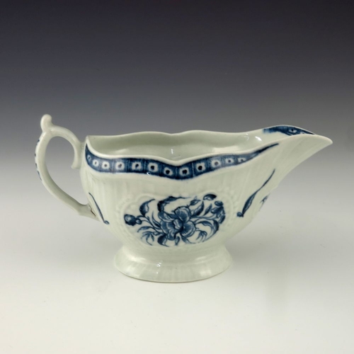 1172 - A Worcester blue and white relief moulded sauce boat, circa 1775, crescent mark, painted in the Stra... 