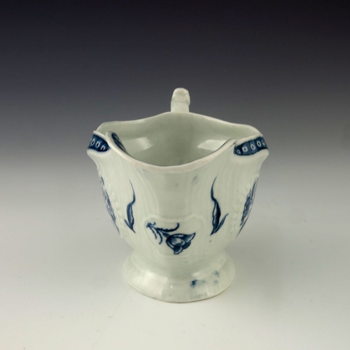 1172 - A Worcester blue and white relief moulded sauce boat, circa 1775, crescent mark, painted in the Stra... 