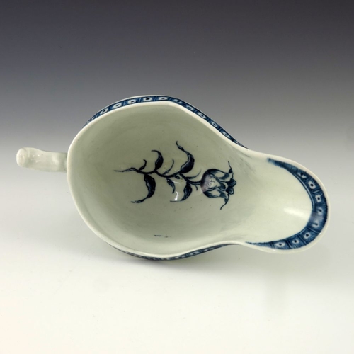 1172 - A Worcester blue and white relief moulded sauce boat, circa 1775, crescent mark, painted in the Stra... 