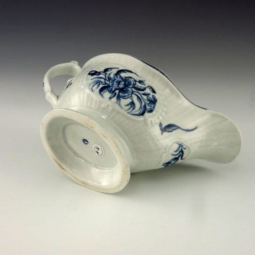 1172 - A Worcester blue and white relief moulded sauce boat, circa 1775, crescent mark, painted in the Stra... 