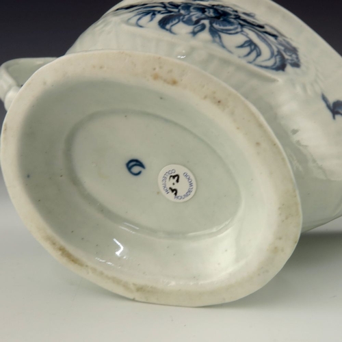 1172 - A Worcester blue and white relief moulded sauce boat, circa 1775, crescent mark, painted in the Stra... 