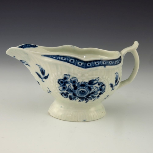 1173 - A small Worcester blue and white relief moulded sauce boat, circa 1775, crescent mark, painted in th... 