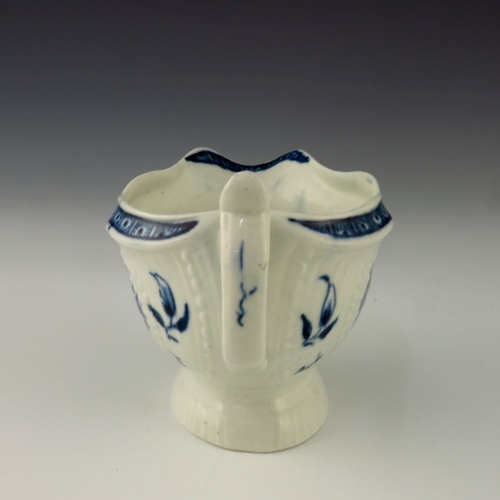 1173 - A small Worcester blue and white relief moulded sauce boat, circa 1775, crescent mark, painted in th... 