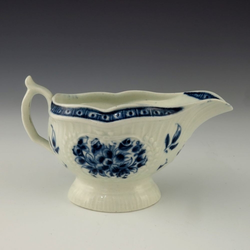 1173 - A small Worcester blue and white relief moulded sauce boat, circa 1775, crescent mark, painted in th... 