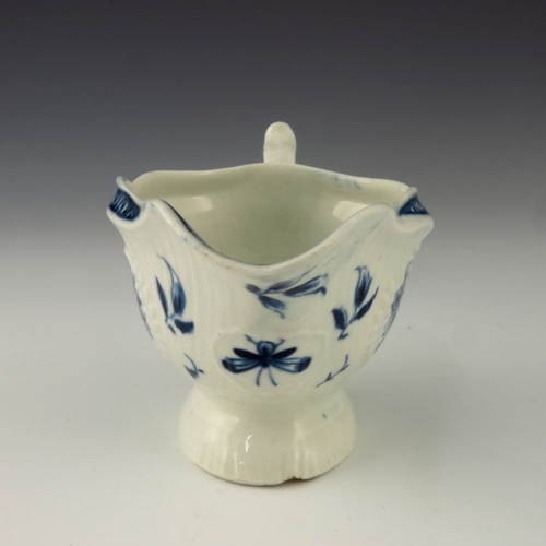 1173 - A small Worcester blue and white relief moulded sauce boat, circa 1775, crescent mark, painted in th... 