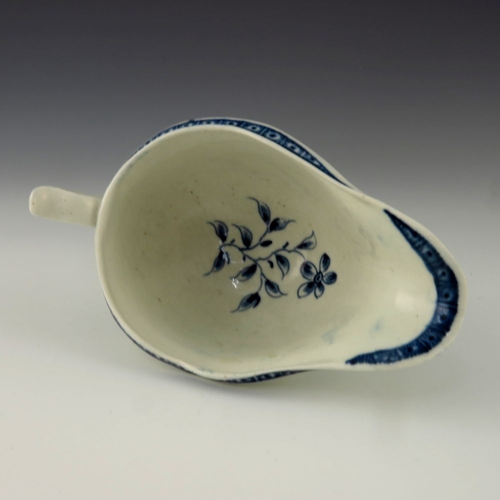 1173 - A small Worcester blue and white relief moulded sauce boat, circa 1775, crescent mark, painted in th... 