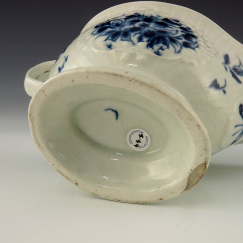 1173 - A small Worcester blue and white relief moulded sauce boat, circa 1775, crescent mark, painted in th... 