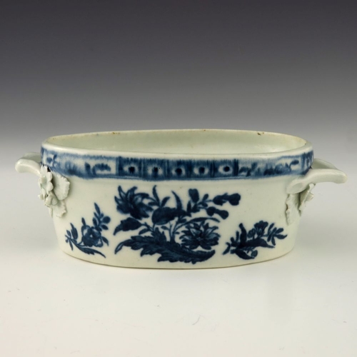 1174 - A Worcester blue and white twin handled butter dish, circa 1770, crescent mark, decorated in the Thr... 