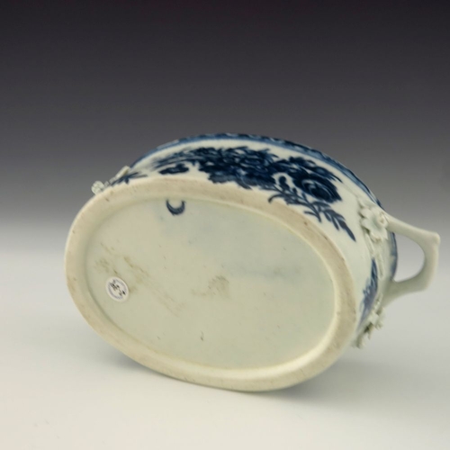 1174 - A Worcester blue and white twin handled butter dish, circa 1770, crescent mark, decorated in the Thr... 