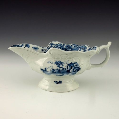 1175 - A Worcester blue and white relief moulded sauce boat, circa 1755, workman's mark, painted in the Tri... 