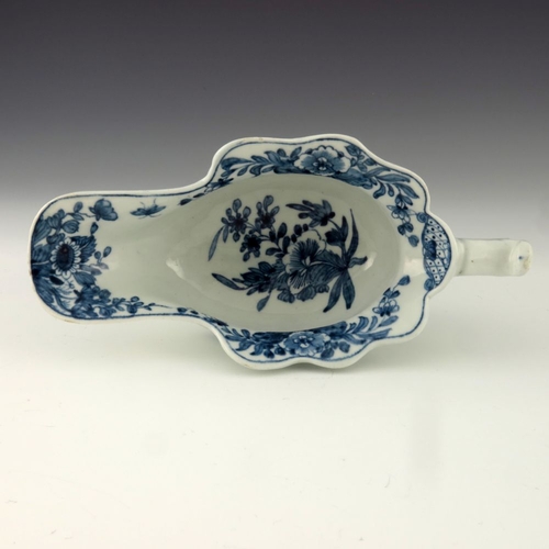 1175 - A Worcester blue and white relief moulded sauce boat, circa 1755, workman's mark, painted in the Tri... 