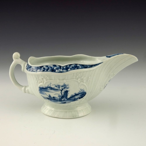 1176 - A Worcester blue and white relief moulded sauce boat, circa 1760, workman's mark, painted with the F... 