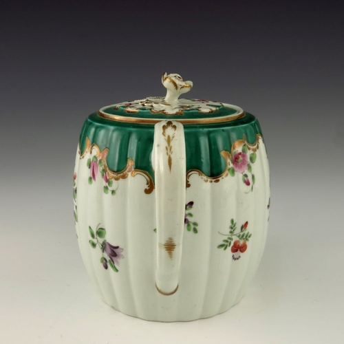 1179 - A Worcester polychrome teapot, circa 1760, painted with floral bouquets below a Rococo C scroll gree... 