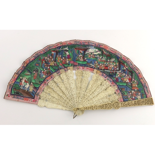 521 - A mid 19th Century Chinese fan, open fretwork and blind carved ivory sticks, the paper fan painted w... 