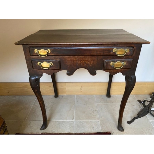 342a - A George II country oak lowboy, circa 1750, moulded top, single long frieze drawer with two short dr... 