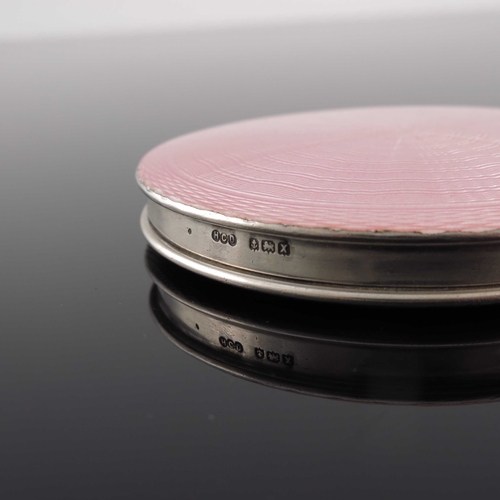 111 - A George VI silver and enamelled compact, Henry Clifford Davis, Birmingham 1947, circular with pink ... 